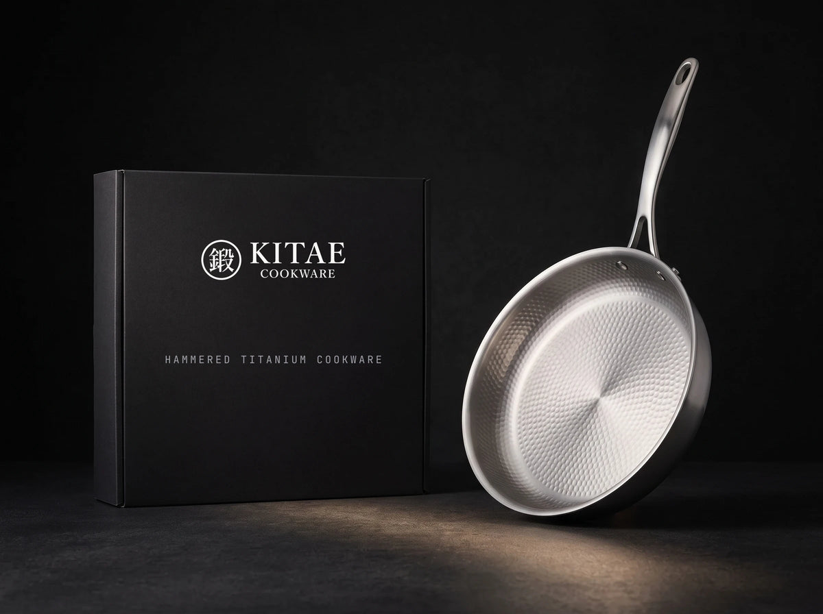 The Kitae titanium frying pan beside its black gift box